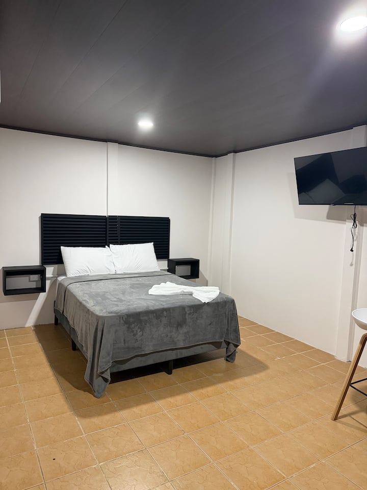 Starfish Room - bed area with clean modern design